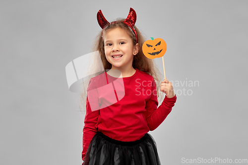 Image of girl in halloween costume with jack-o-lantern