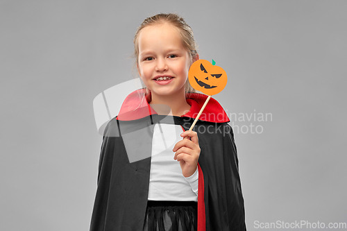 Image of girl in costume of dracula with cape on halloween