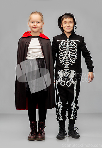 Image of happy children in halloween costumes