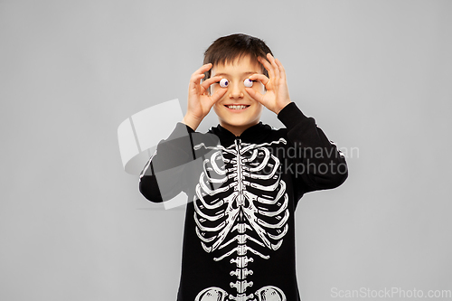 Image of boy in halloween costume of skeleton with eyeballs