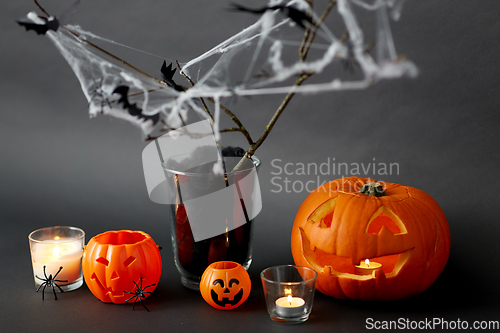 Image of pumpkins, candles and halloween decorations