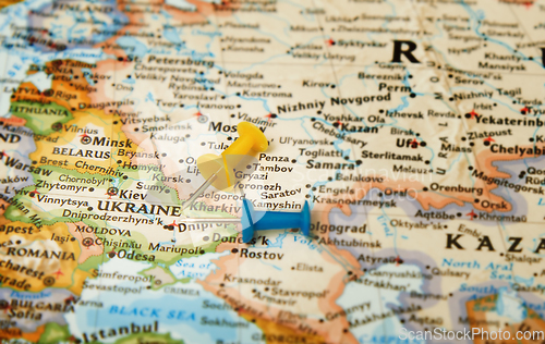 Image of Pushpins on a map with focus on Ukraine