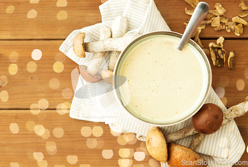 Image of mushroom cream soup in bowl on cutting board