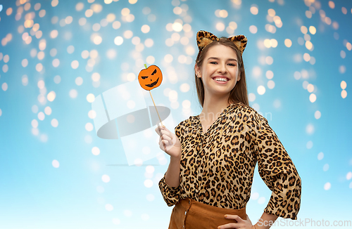 Image of happy woman in halloween costume of leopard