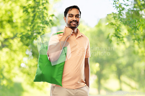 Image of man with reusable canvas bag for food shopping