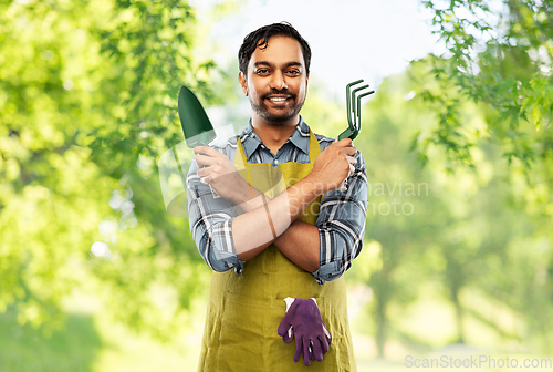 Image of indian gardener or farmer with box of garden tools
