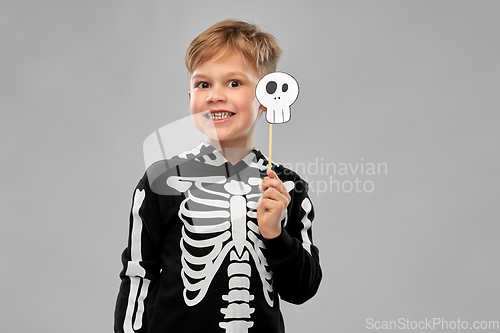 Image of boy in halloween costume of skeleton making faces