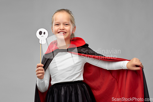 Image of girl in costume of dracula with cape on halloween