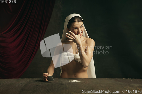 Image of Modern remake of classical artwork with coronavirus theme - young medieval woman on dark background