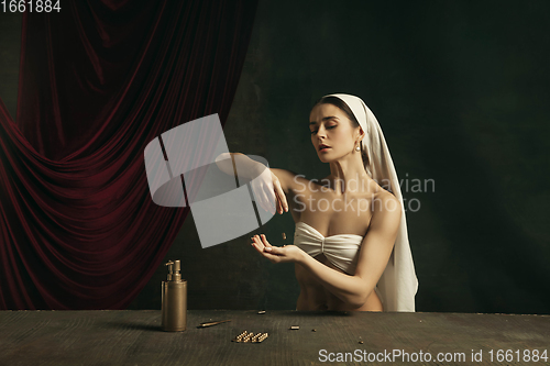 Image of Modern remake of classical artwork with coronavirus theme - young medieval woman on dark background