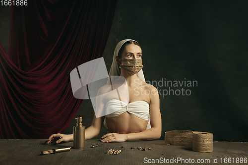 Image of Modern remake of classical artwork with coronavirus theme - young medieval woman on dark background