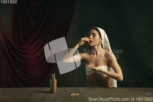 Image of Modern remake of classical artwork with coronavirus theme - young medieval woman on dark background