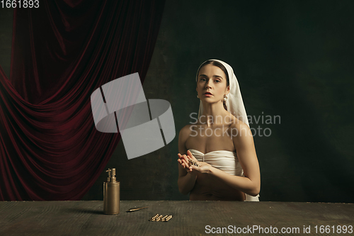 Image of Modern remake of classical artwork with coronavirus theme - young medieval woman on dark background