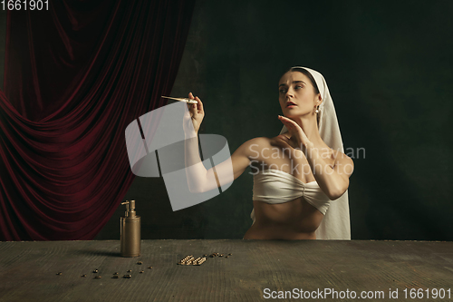 Image of Modern remake of classical artwork with coronavirus theme - young medieval woman on dark background