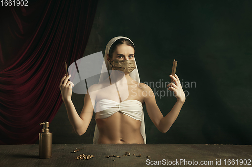 Image of Modern remake of classical artwork with coronavirus theme - young medieval woman on dark background