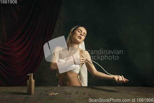 Image of Modern remake of classical artwork with coronavirus theme - young medieval woman on dark background