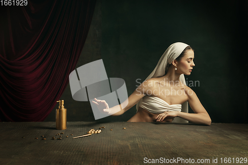 Image of Modern remake of classical artwork with coronavirus theme - young medieval woman on dark background