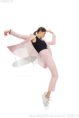 Image of Happy young woman dancing in stylish clothes or suit, remaking legendary moves of celebrity from culture history