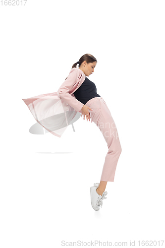 Image of Happy young woman dancing in stylish clothes or suit, remaking legendary moves of celebrity from culture history