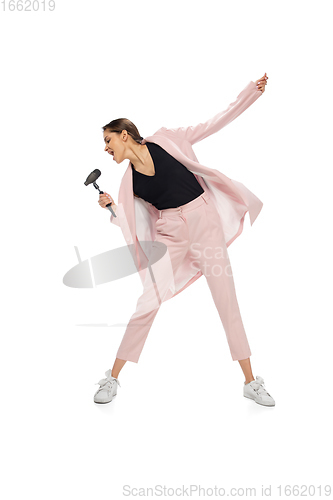 Image of Happy young woman dancing in stylish clothes or suit, remaking legendary moves of celebrity from culture history