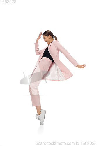 Image of Happy young woman dancing in stylish clothes or suit, remaking legendary moves of celebrity from culture history