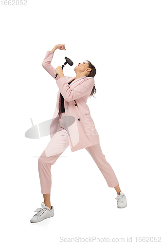 Image of Happy young woman dancing in stylish clothes or suit, remaking legendary moves of celebrity from culture history