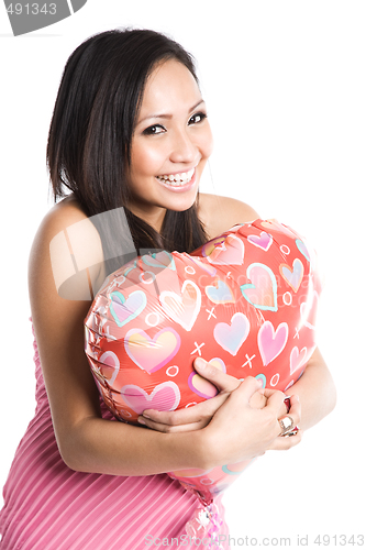 Image of Asian woman hugging heart-shaped balloon