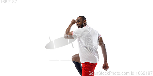 Image of Funny emotions of professional football, soccer player isolated on white studio background, excitement in game