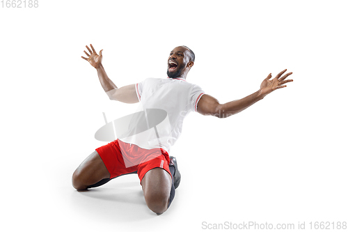 Image of Funny emotions of professional football, soccer player isolated on white studio background, excitement in game