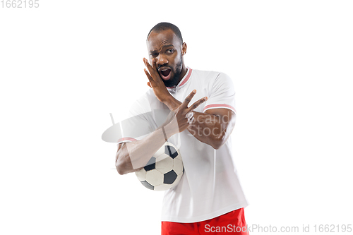 Image of Funny emotions of professional football, soccer player isolated on white studio background, excitement in game
