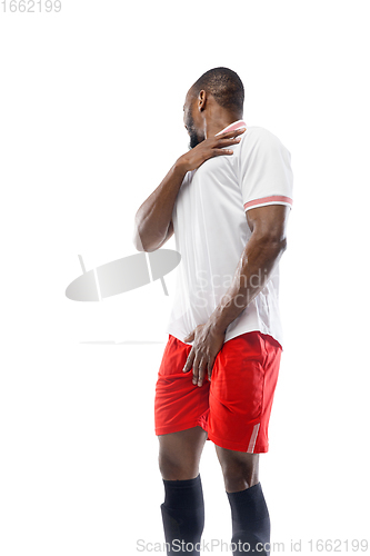 Image of Funny emotions of professional football, soccer player isolated on white studio background, excitement in game