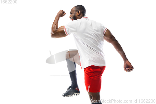 Image of Funny emotions of professional football, soccer player isolated on white studio background, excitement in game