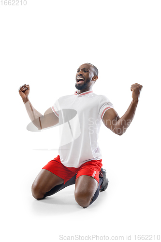 Image of Funny emotions of professional football, soccer player isolated on white studio background, excitement in game