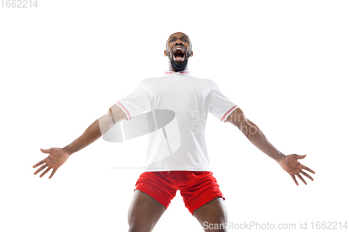 Image of Funny emotions of professional football, soccer player isolated on white studio background, excitement in game