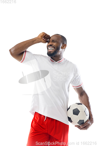 Image of Funny emotions of professional football, soccer player isolated on white studio background, excitement in game