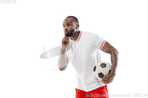 Image of Funny emotions of professional football, soccer player isolated on white studio background, excitement in game