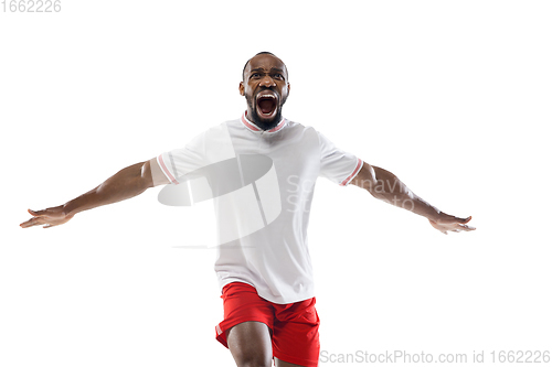 Image of Funny emotions of professional football, soccer player isolated on white studio background, excitement in game