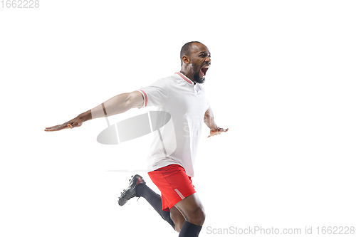 Image of Funny emotions of professional football, soccer player isolated on white studio background, excitement in game