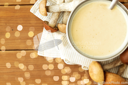 Image of mushroom cream soup in bowl on cutting board