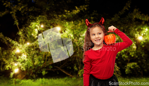 Image of girl in halloween costume with jack-o-lantern