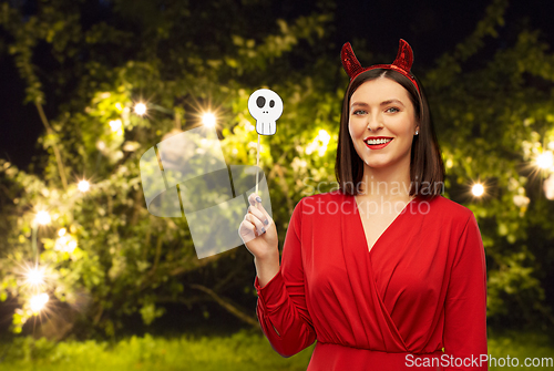 Image of happy woman in red halloween costume of devil
