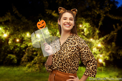 Image of happy woman in halloween costume of leopard