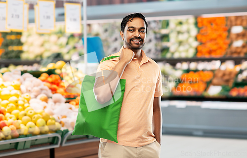 Image of man with reusable canvas bag for food shopping