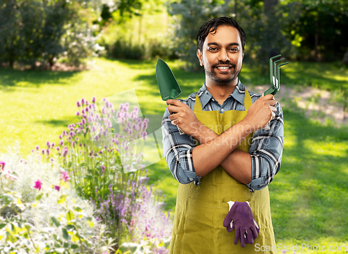 Image of indian gardener or farmer with box of garden tools
