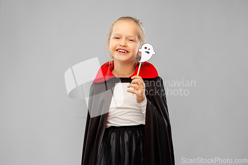 Image of girl in costume of dracula with cape on halloween