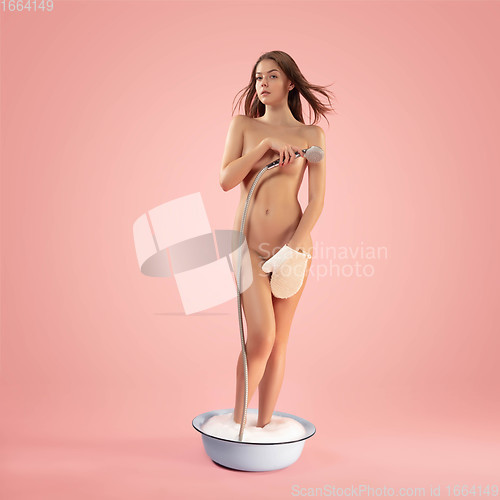 Image of Portrait of a girl like modern remake of the Birth of Venus by Botticelli on pink background with copyspace