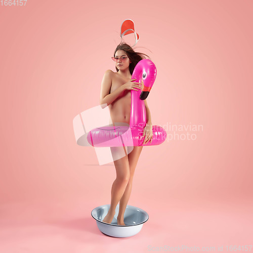 Image of Portrait of a girl like modern remake of the Birth of Venus by Botticelli on pink background with copyspace