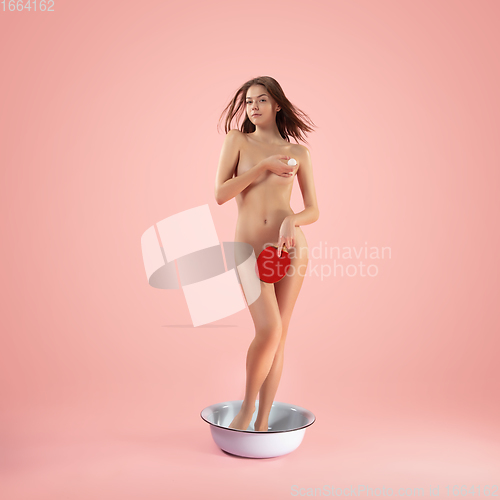 Image of Portrait of a girl like modern remake of the Birth of Venus by Botticelli on pink background with copyspace