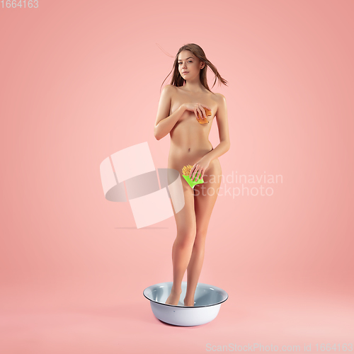 Image of Portrait of a girl like modern remake of the Birth of Venus by Botticelli on pink background with copyspace