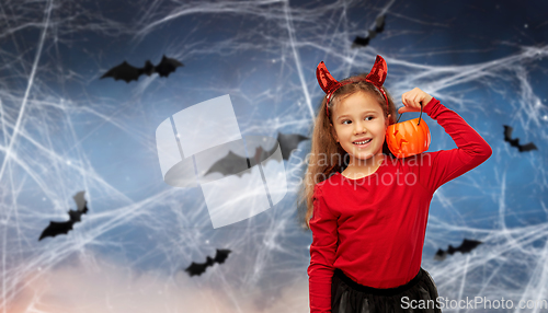 Image of girl in halloween costume with jack-o-lantern